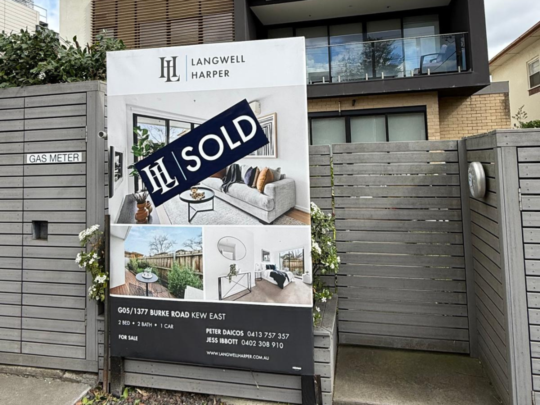 A real estate sales board for a property that was sold on Burke Road, Kew by the Kew based estate agency Langwell Harper. Listing agent Peter Daicos